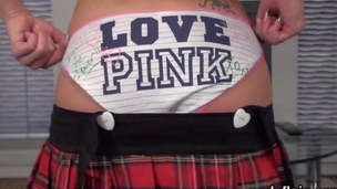 Cute little nymph teases while stripping her school girl outfit