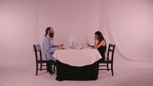 Gorgeous brunette lady with attractive long hair invited by elderly bearded businessman at the beautiful romantic dinner in the restaurant. But something goes wrong.