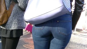 Candid redhead with peach ass in taut jeans